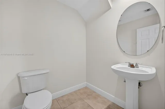 an aerial view of residential building with lake view