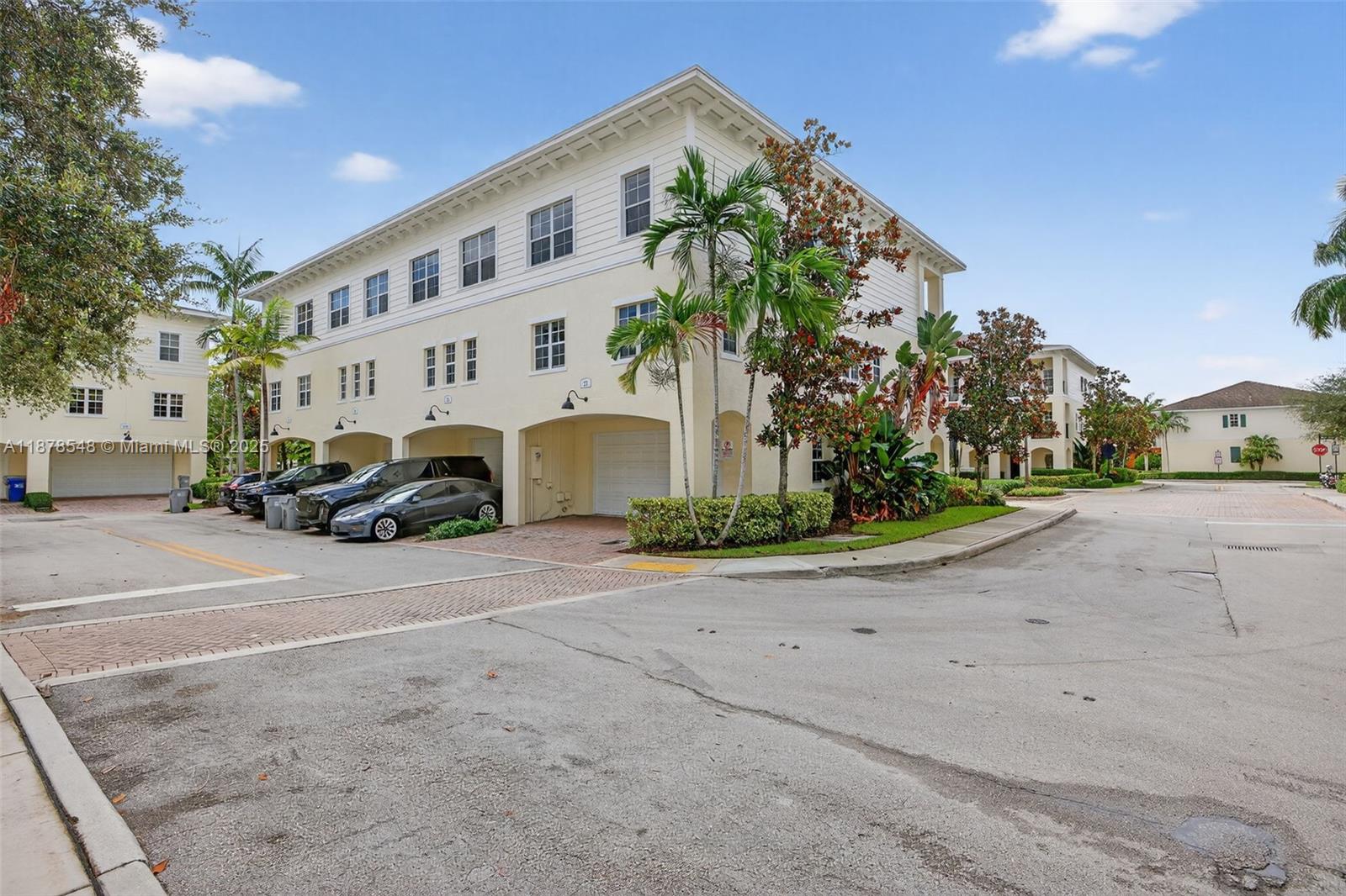 27 Southwest 6th Court Pompano Beach, FL 33060 - Photo 50 of 70 a front view of a building with cars parked on road