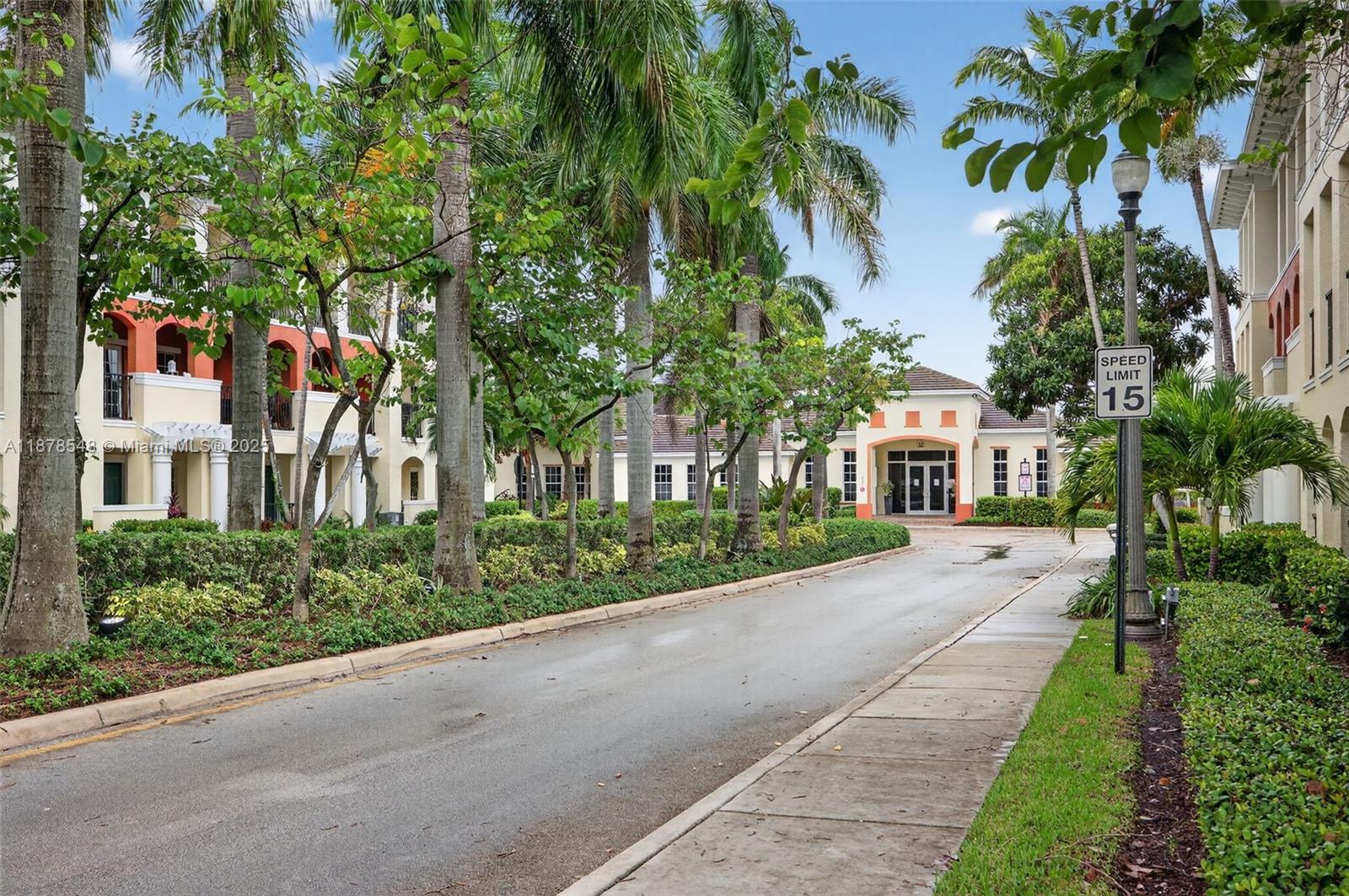 27 Southwest 6th Court Pompano Beach, FL 33060 - Photo 58 of 70 a front view of a house with a garden and trees