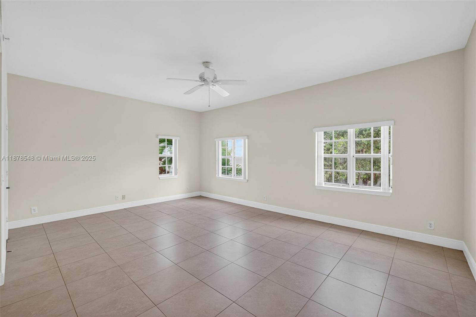 27 Southwest 6th Court Pompano Beach, FL 33060 - Photo 9 of 70 a view of an empty room with a window