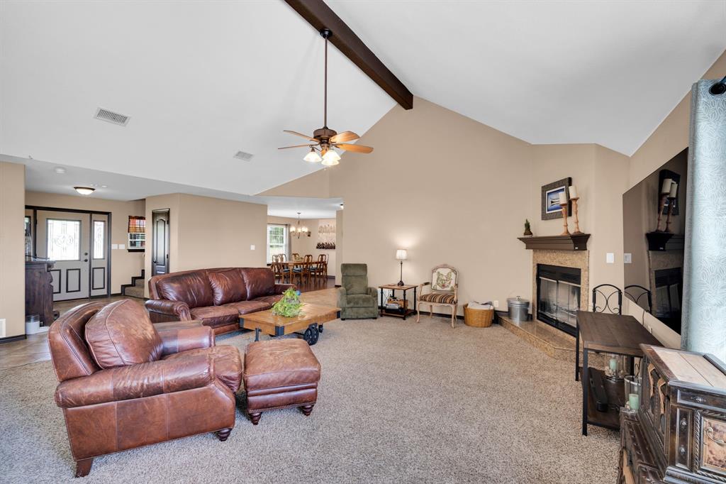 130 Eubanks Road Maypearl, TX 76064 - Photo 19 of 39 a living room with furniture and a flat screen tv