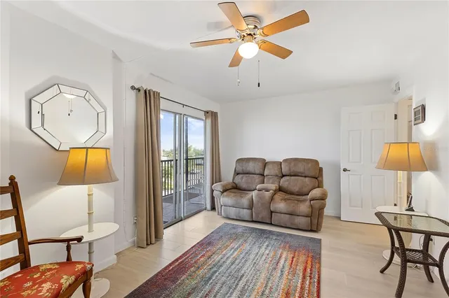 a balcony with furniture and a table