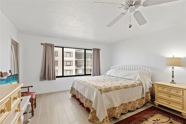 a bedroom with a bed and a dresser in it