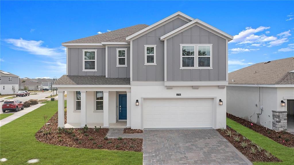 5798 Stephens Road St. Cloud, FL 34771 - Photo 1 of 1 a front view of a house with a yard