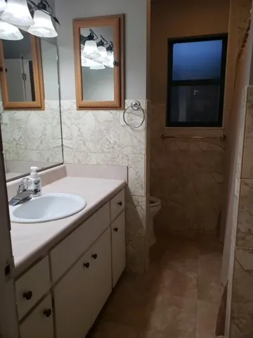 a bathroom with a sink and mirror