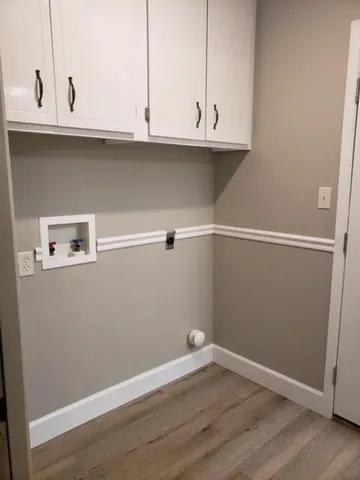 a view of cabinets and wooden floor