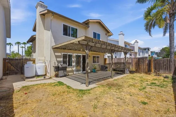 a house with palm tree in front of it