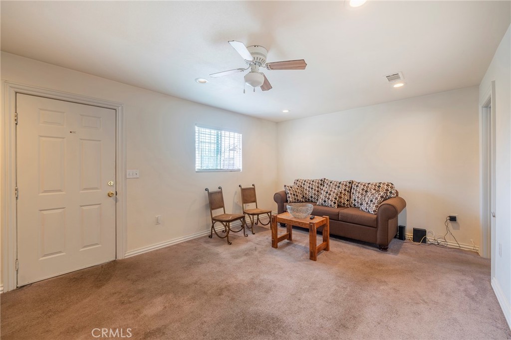 2734 West Caldwell Street Compton, CA 90220 - Photo 13 of 39 a living room with furniture and a ceiling fan