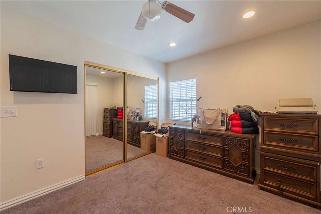 2734 West Caldwell Street Compton, CA 90220 - Photo 20 of 39 a living room with furniture and a flat screen tv
