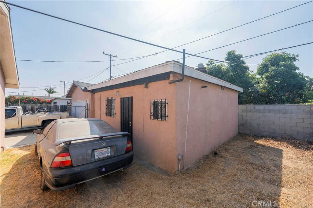 2734 West Caldwell Street Compton, CA 90220 - Photo 29 of 39 a car parked in front of house