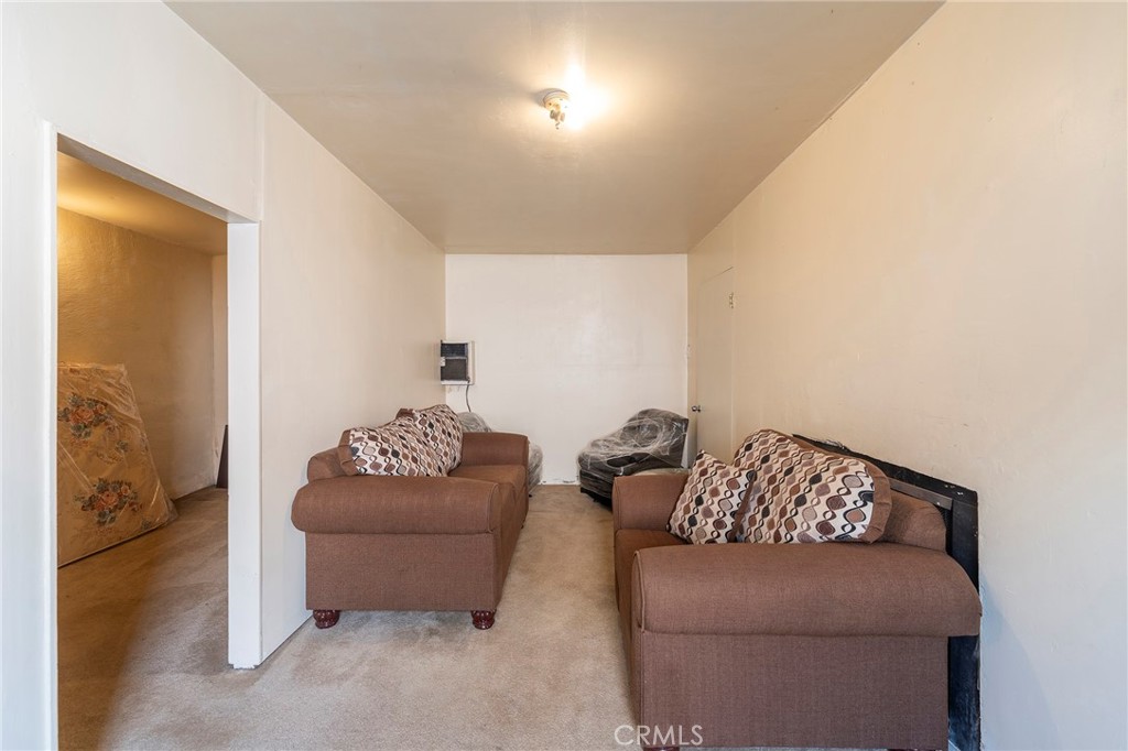 2734 West Caldwell Street Compton, CA 90220 - Photo 31 of 39 a living room with furniture