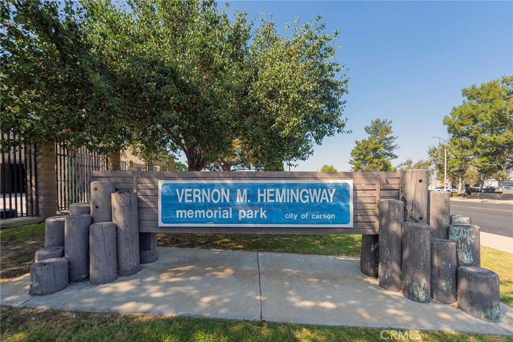 2734 West Caldwell Street Compton, CA 90220 - Photo 36 of 39 a view of outdoor space with signage and flags