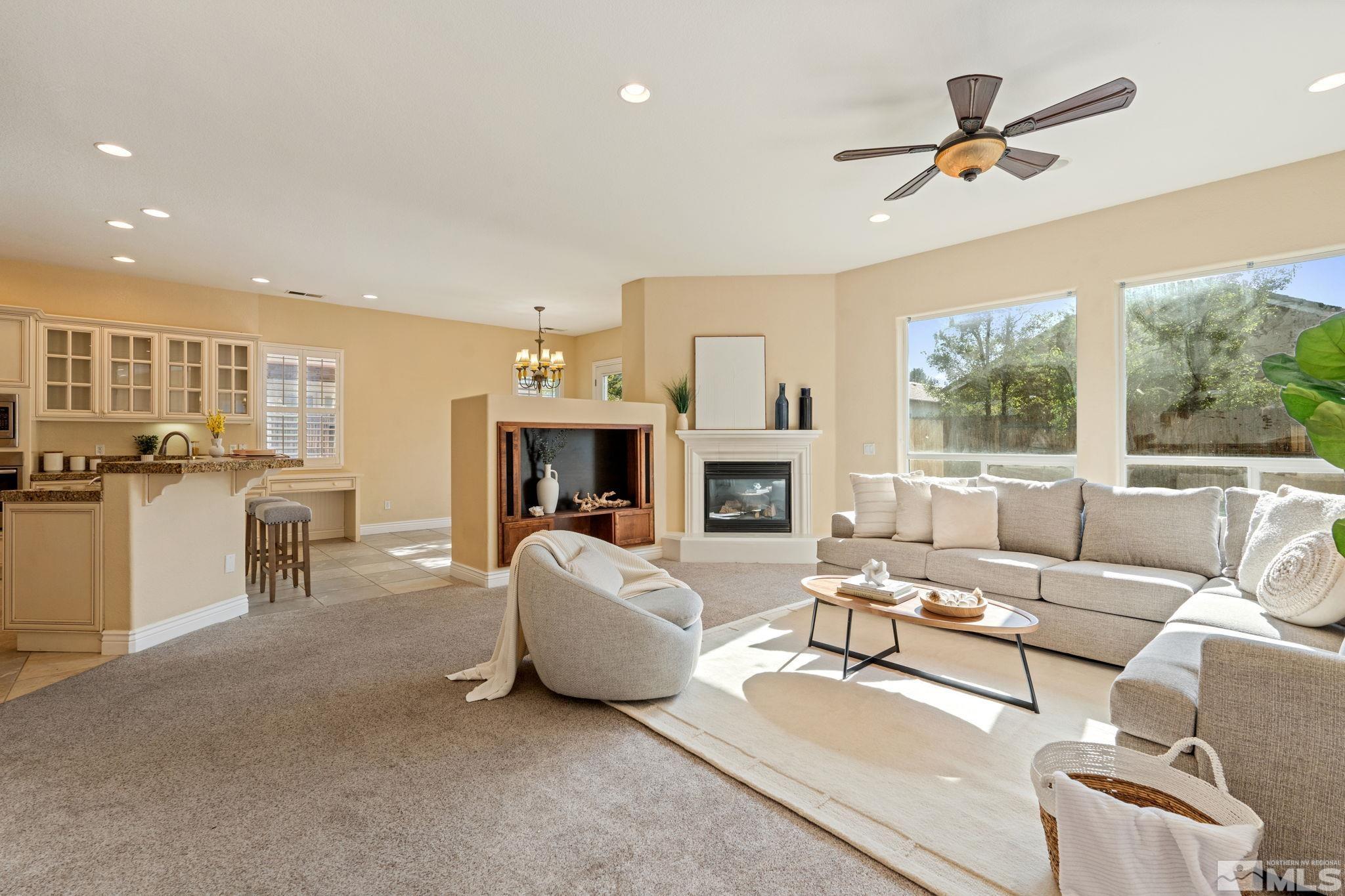 10035 Goler Wash Court Reno, NV 89521 - Photo 16 of 40 a living room with furniture and a fireplace