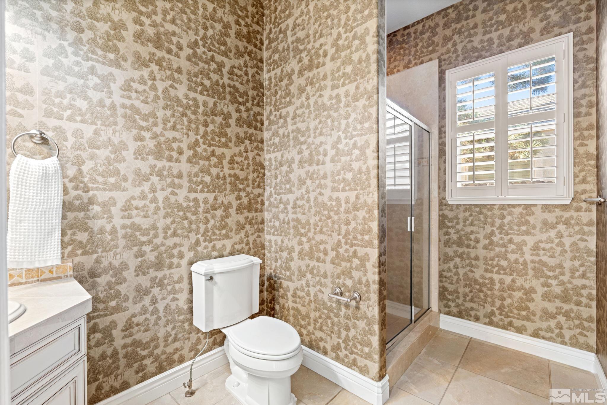 10035 Goler Wash Court Reno, NV 89521 - Photo 30 of 40 a bathroom with a toilet and a shower