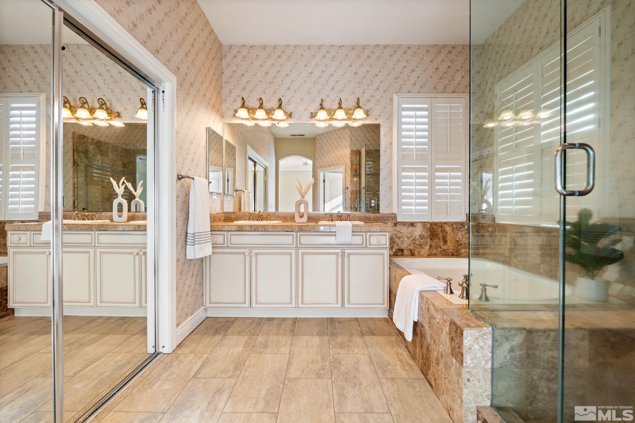 10035 Goler Wash Court Reno, NV 89521 - Photo 34 of 40 a bathroom with a tub sink and mirror