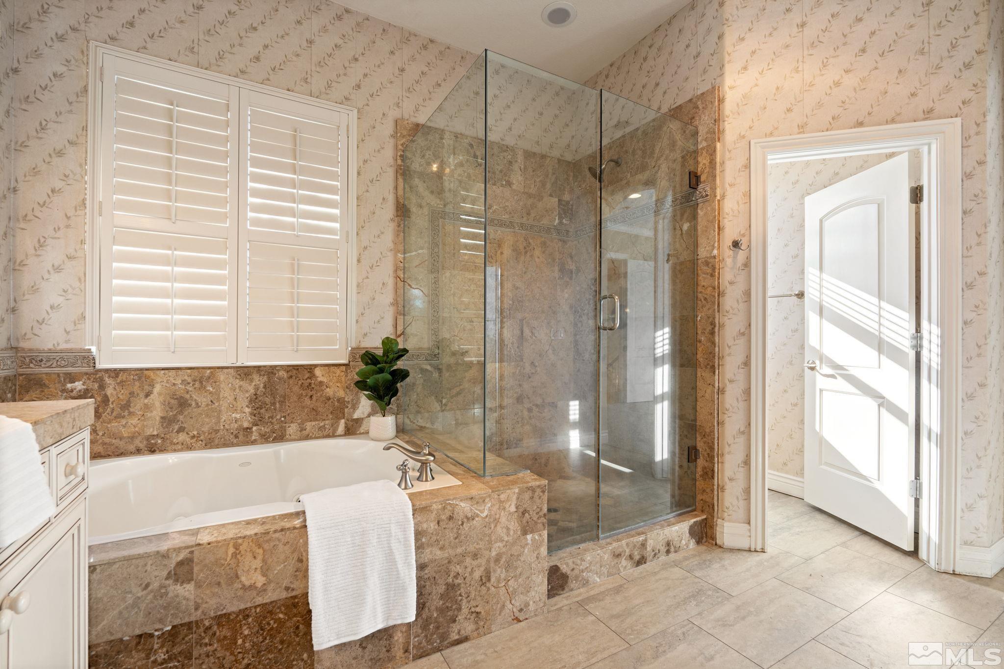 10035 Goler Wash Court Reno, NV 89521 - Photo 36 of 40 a spacious bathroom with a tub shower and sink