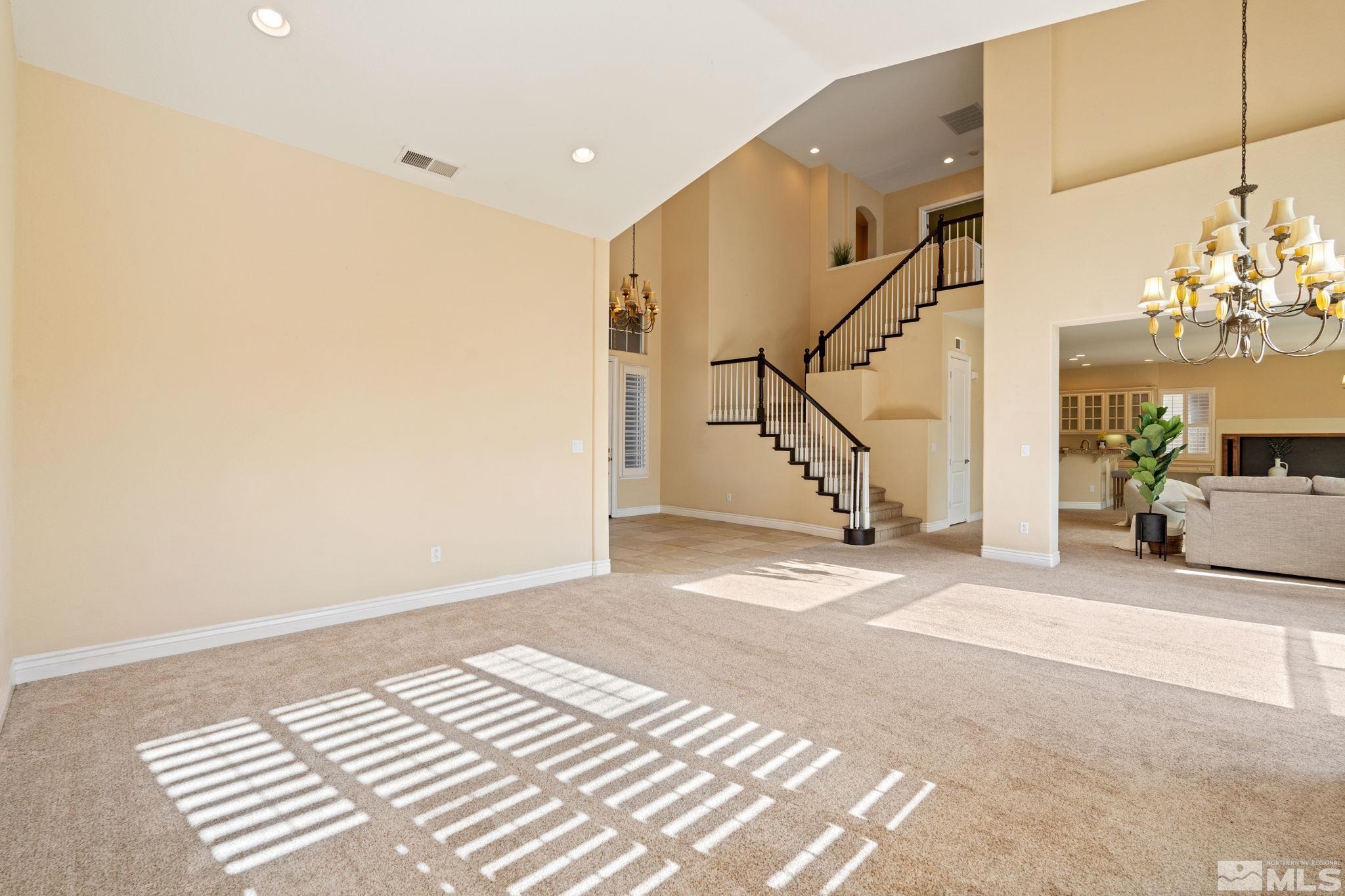 10035 Goler Wash Court Reno, NV 89521 - Photo 5 of 40 a view of a bedroom with wooden floor and stairs
