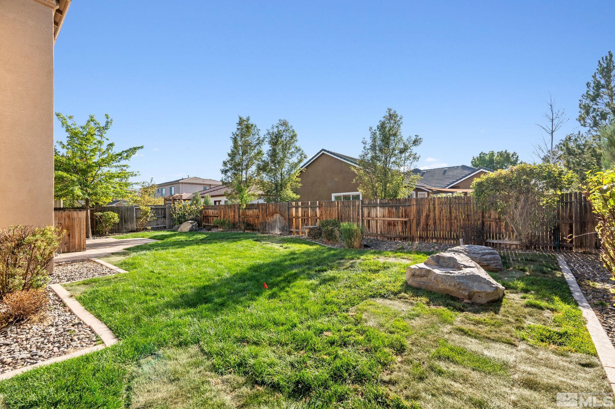10035 Goler Wash Court Reno, NV 89521 - Photo 6 of 40 a backyard of a house with table and chairs