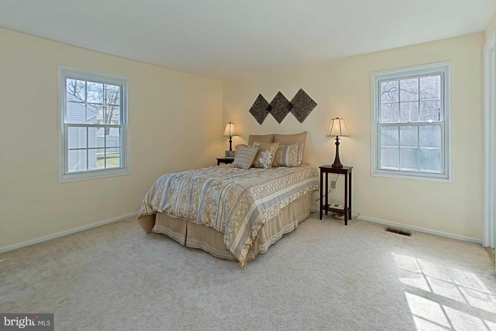 9505 Burning Branch Road Burke, VA 22015 - Photo 16 of 30 a bedroom with a bed and a window