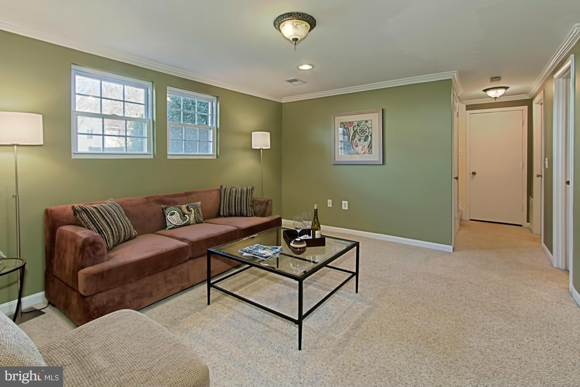 9505 Burning Branch Road Burke, VA 22015 - Photo 21 of 30 a living room with furniture and a window