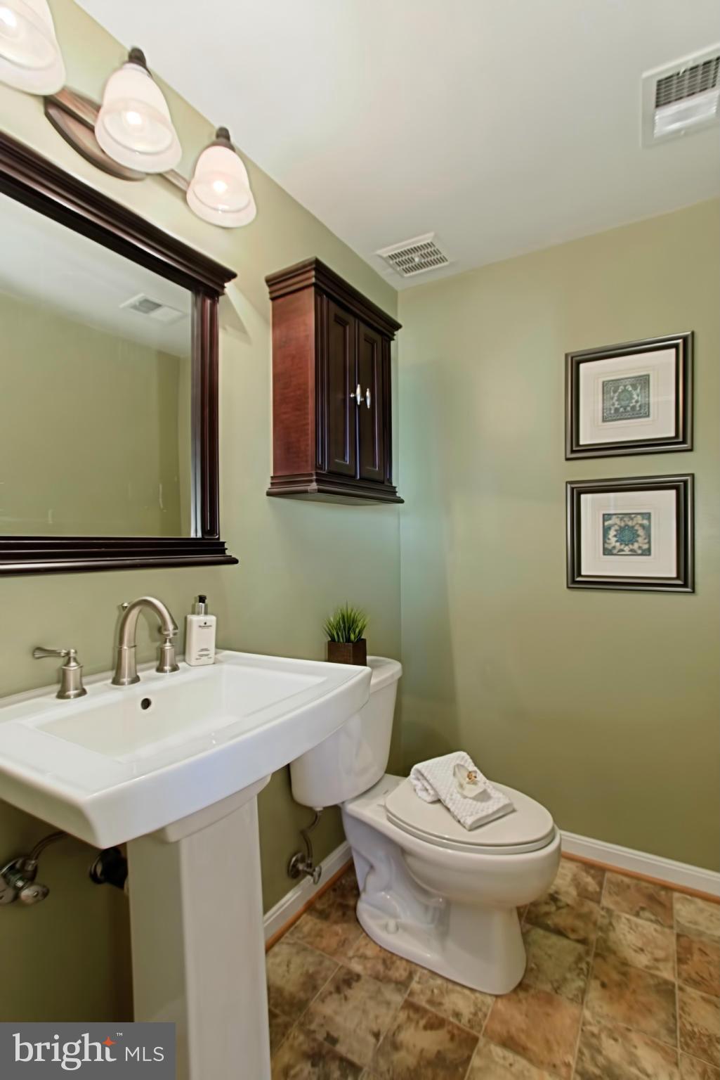 9505 Burning Branch Road Burke, VA 22015 - Photo 26 of 30 a bathroom with a toilet a sink and mirror