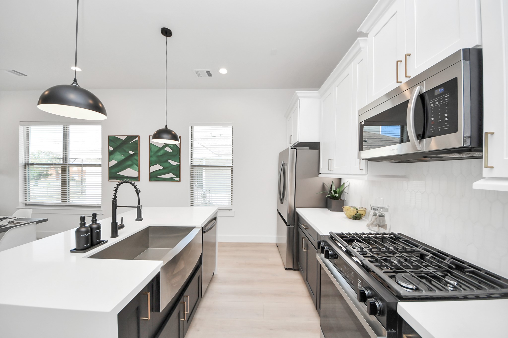 2524 Live Oak Street Houston, TX 77004 - Photo 19 of 50 a kitchen with stainless steel appliances granite countertop a sink stove and refrigerator