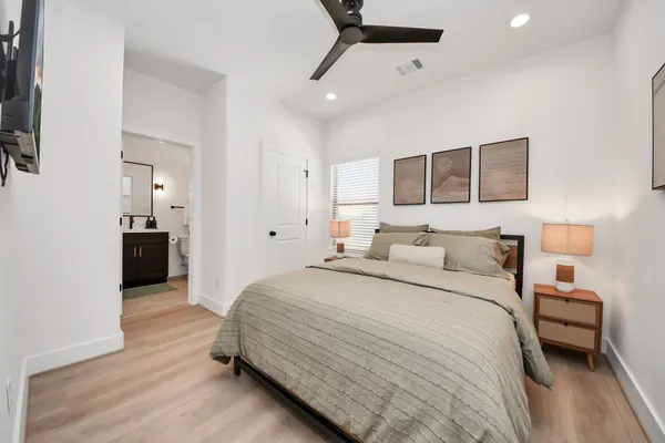 a bedroom with a bed and window