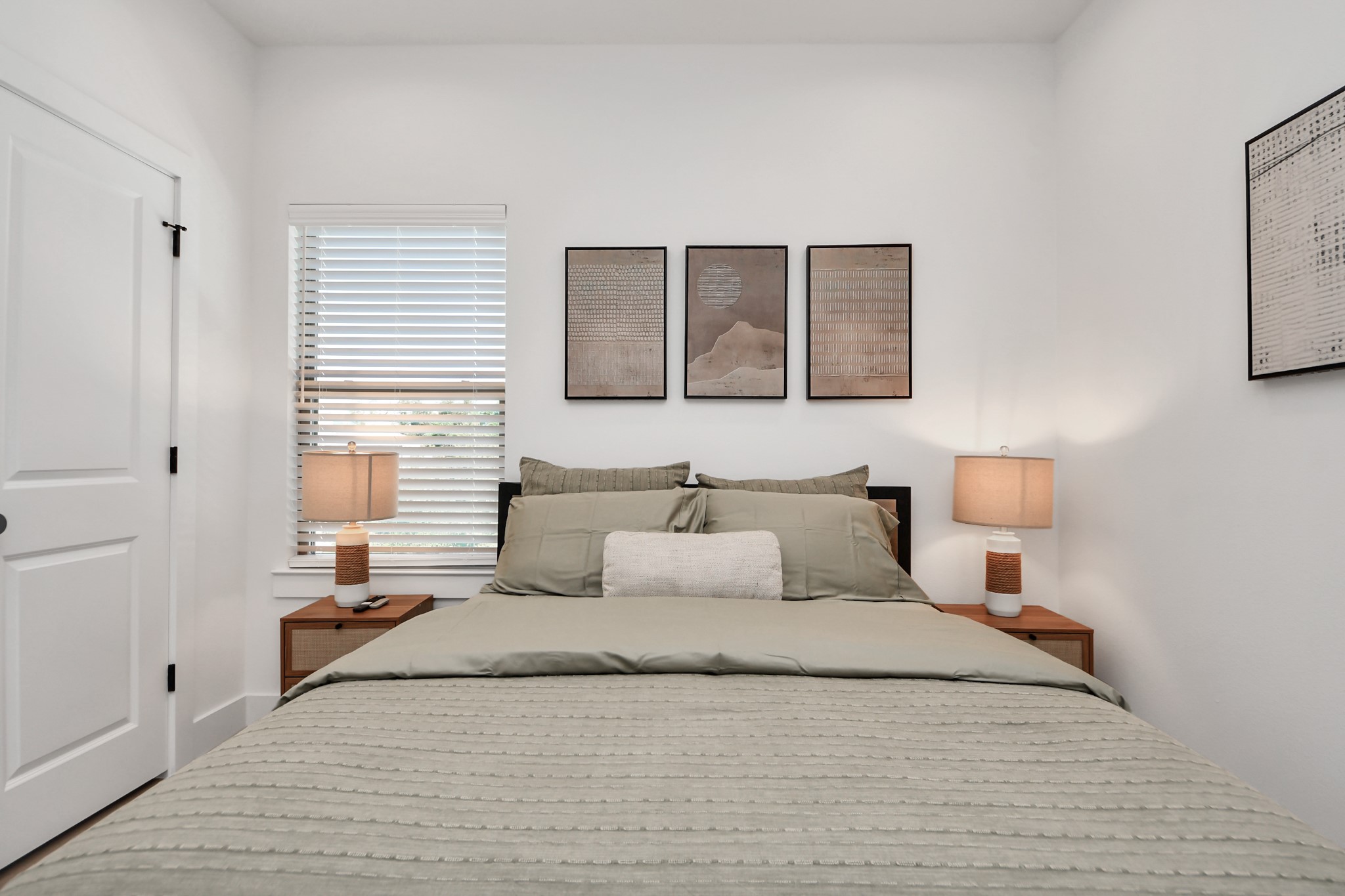 2524 Live Oak Street Houston, TX 77004 - Photo 34 of 50 a bedroom with a bed and window