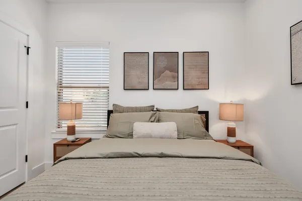 a bedroom with a bed and window