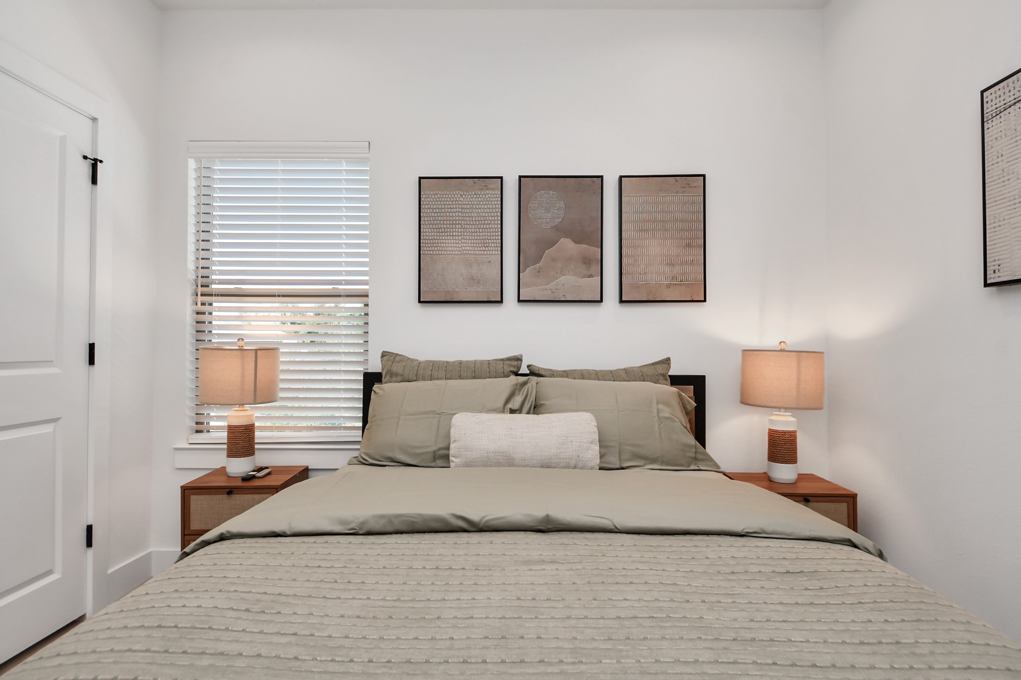 2524 Live Oak Street Houston, TX 77004 - Photo 35 of 50 a bedroom with a bed and window