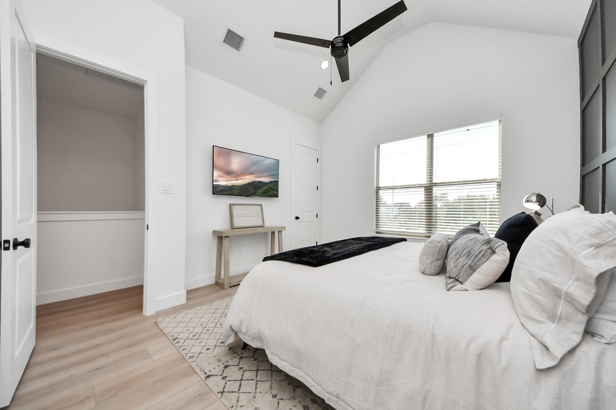 2524 Live Oak Street Houston, TX 77004 - Photo 39 of 50 a bedroom with a bed and window