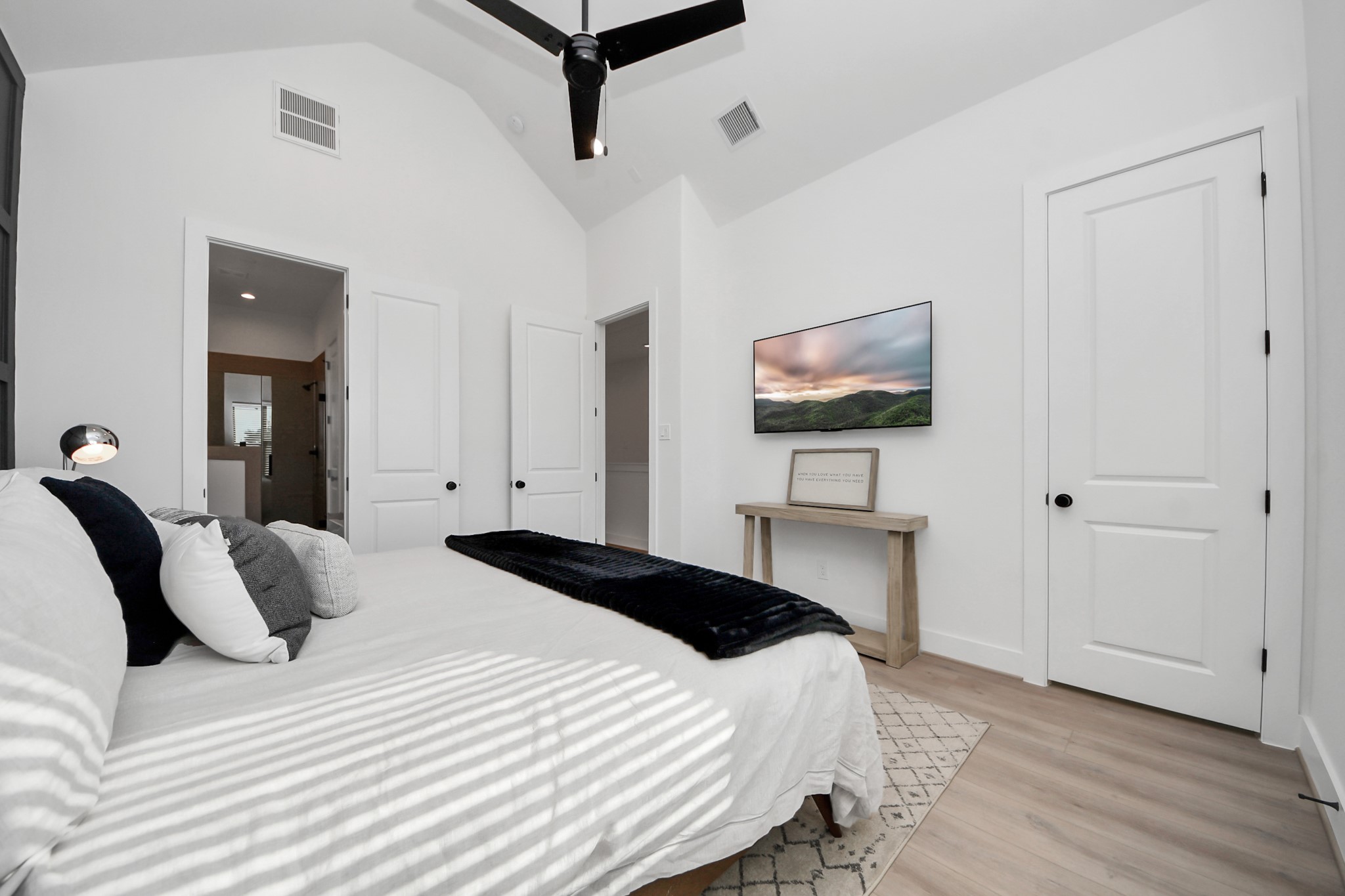 2524 Live Oak Street Houston, TX 77004 - Photo 42 of 50 a bedroom with a bed and a painting on the wall