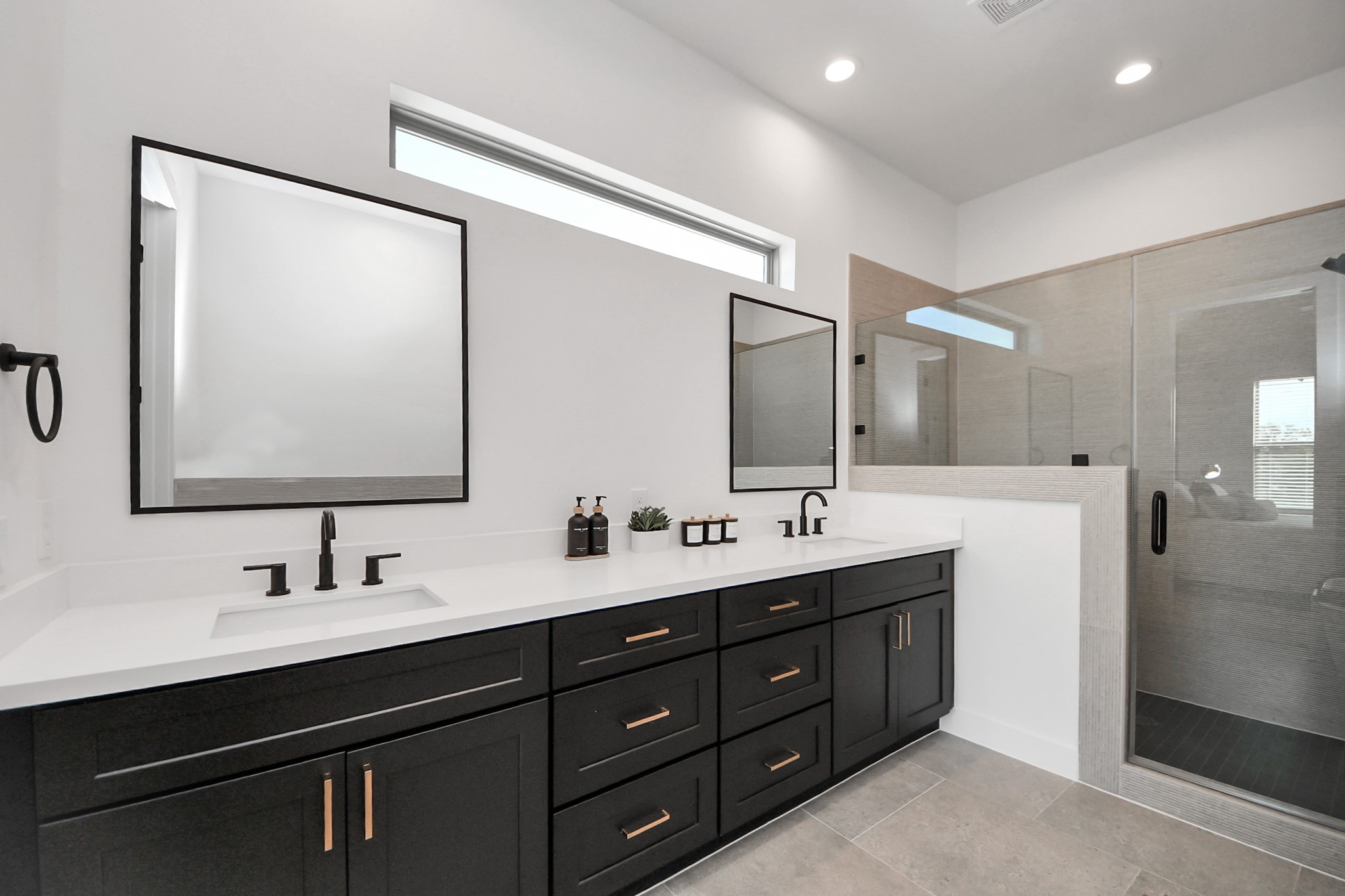 2524 Live Oak Street Houston, TX 77004 - Photo 44 of 50 a bathroom with a double vanity sink and mirror