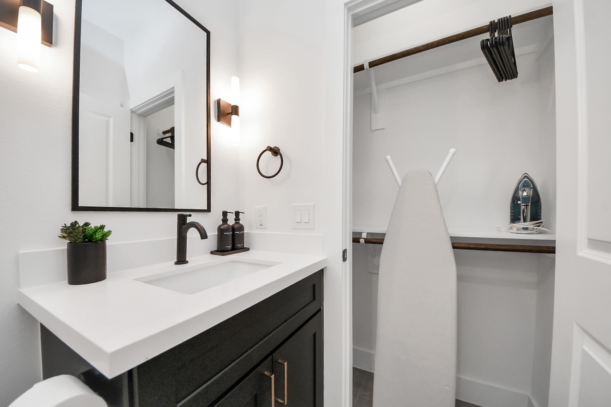2524 Live Oak Street Houston, TX 77004 - Photo 48 of 50 a bathroom with a sink and a mirror