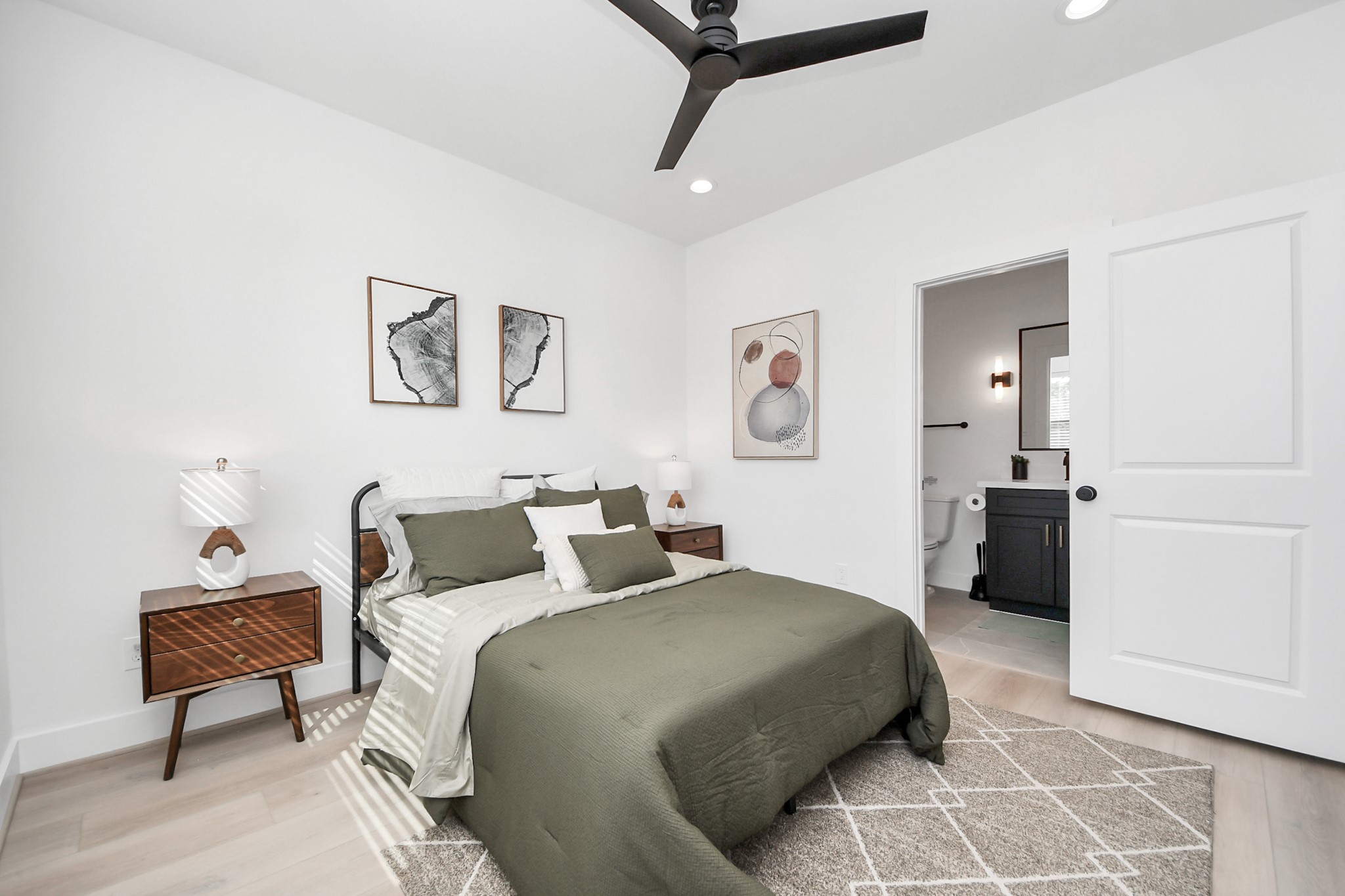 2524 Live Oak Street Houston, TX 77004 - Photo 9 of 50 a bedroom with a bed and a chair