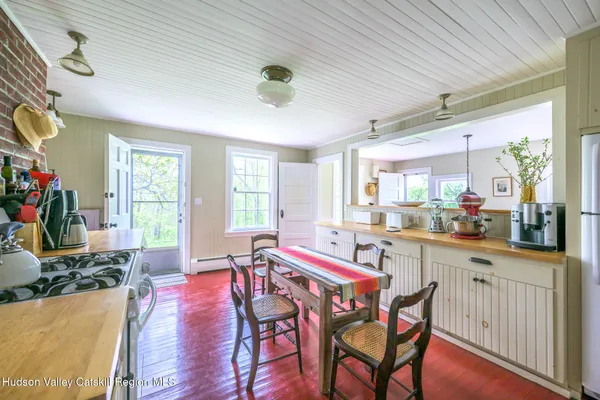 a dining room with furniture window wooden floor