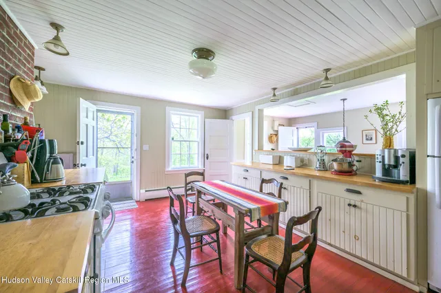 a dining room with furniture window wooden floor