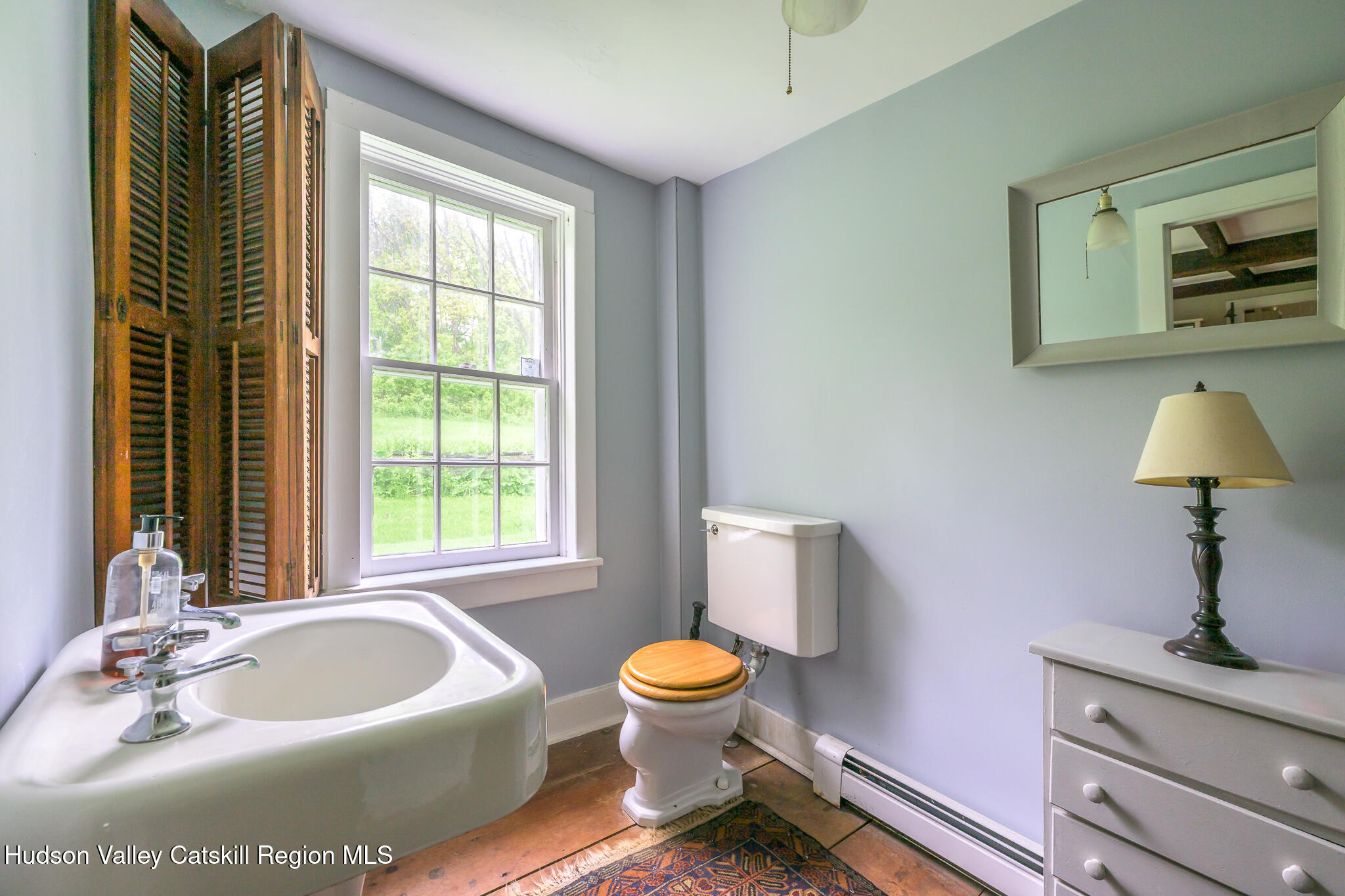 1250 County Rte 351 Rensselaerville, NY 12147 - Photo 14 of 26 a bathroom with a toilet sink and mirror