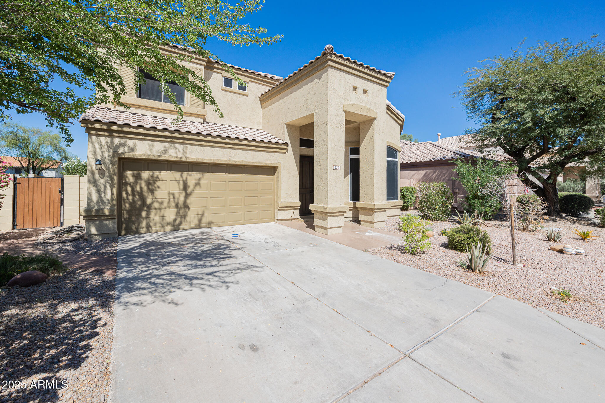 730 West Kent Place Chandler, AZ 85225 - Photo 1 of 29 a front view of a house with a yard