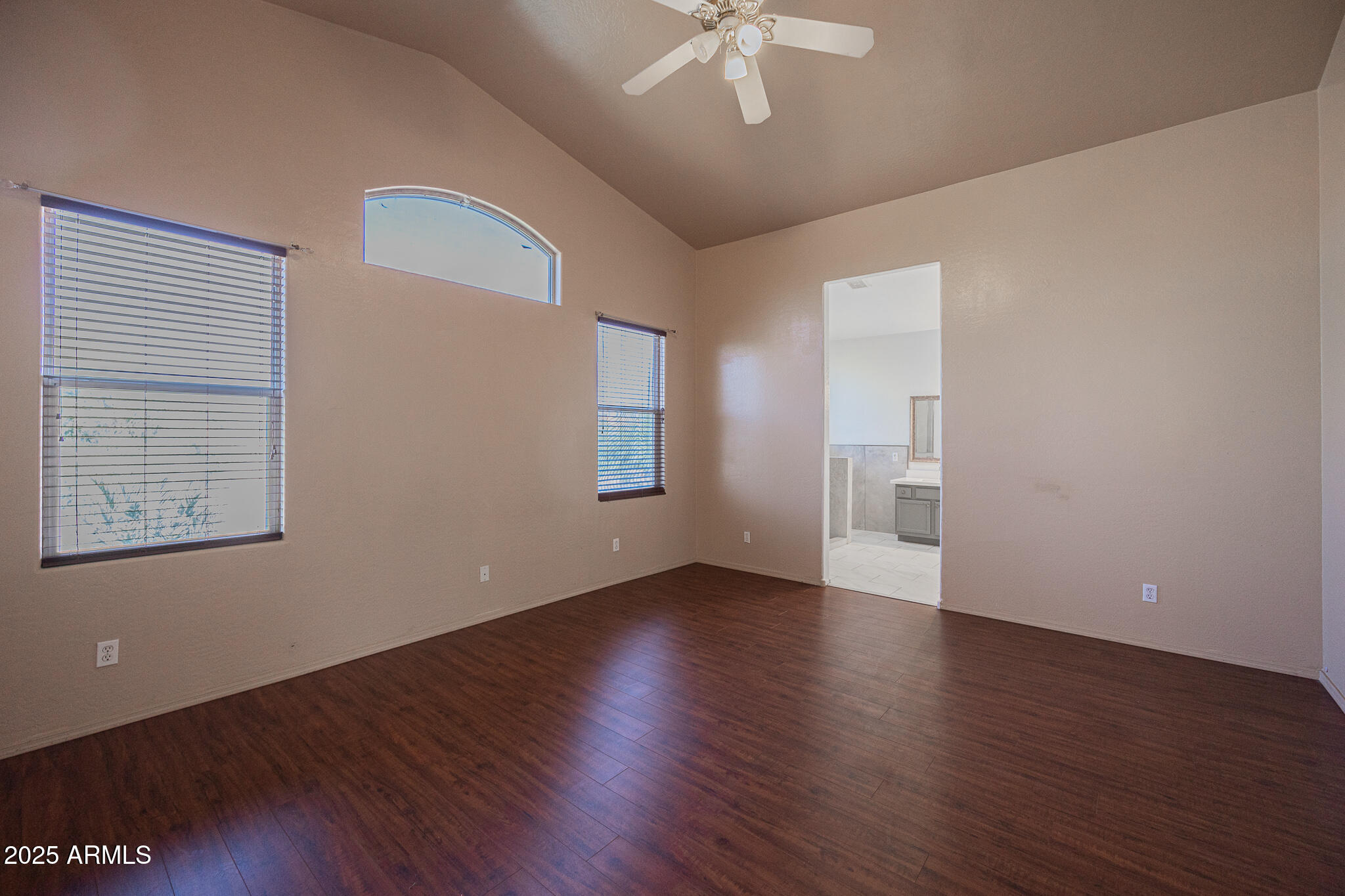 730 West Kent Place Chandler, AZ 85225 - Photo 11 of 29 an empty room with wooden floor chandelier fan and windows