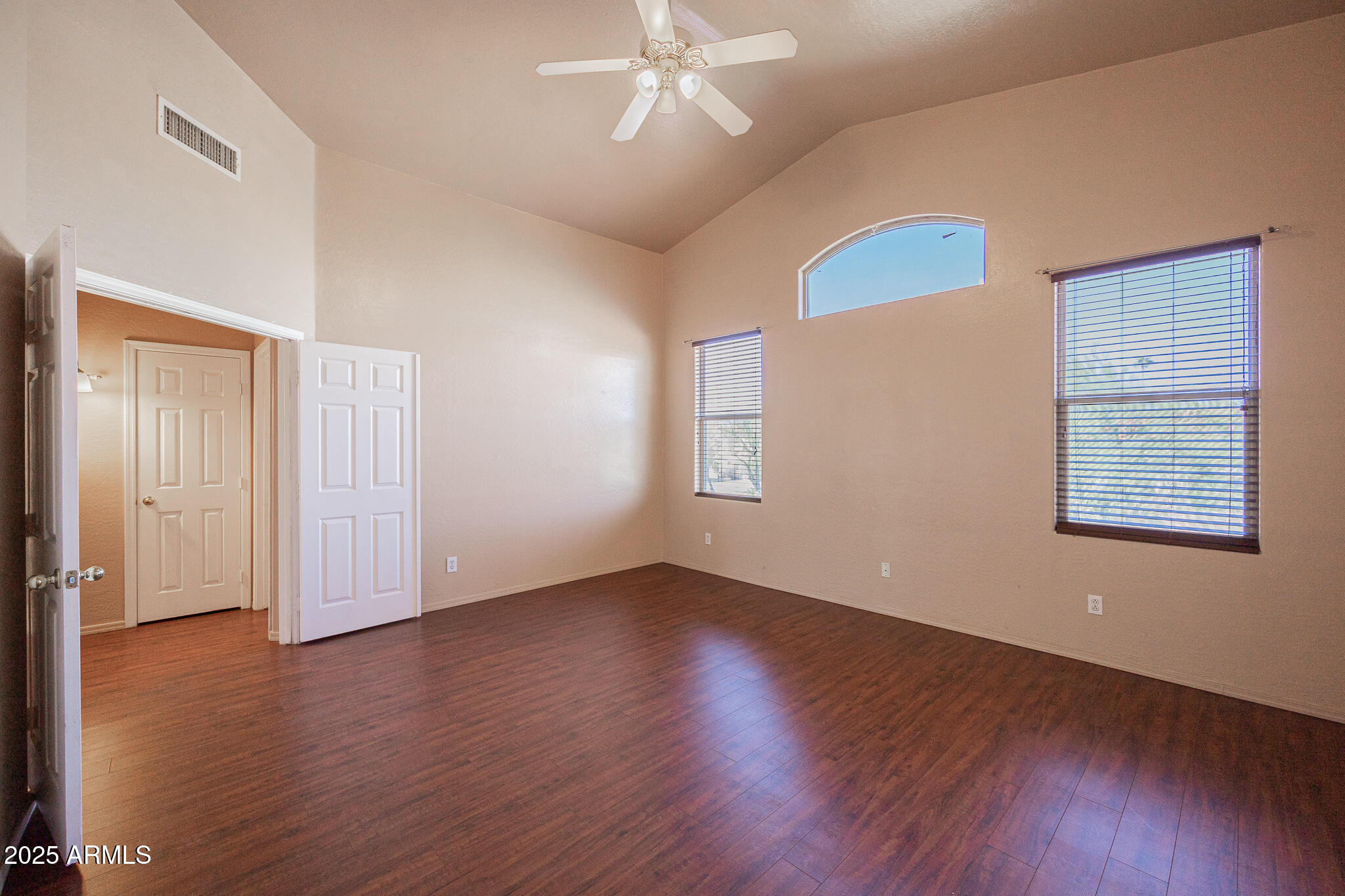 730 West Kent Place Chandler, AZ 85225 - Photo 13 of 29 an empty room with wooden floor chandelier fan and windows
