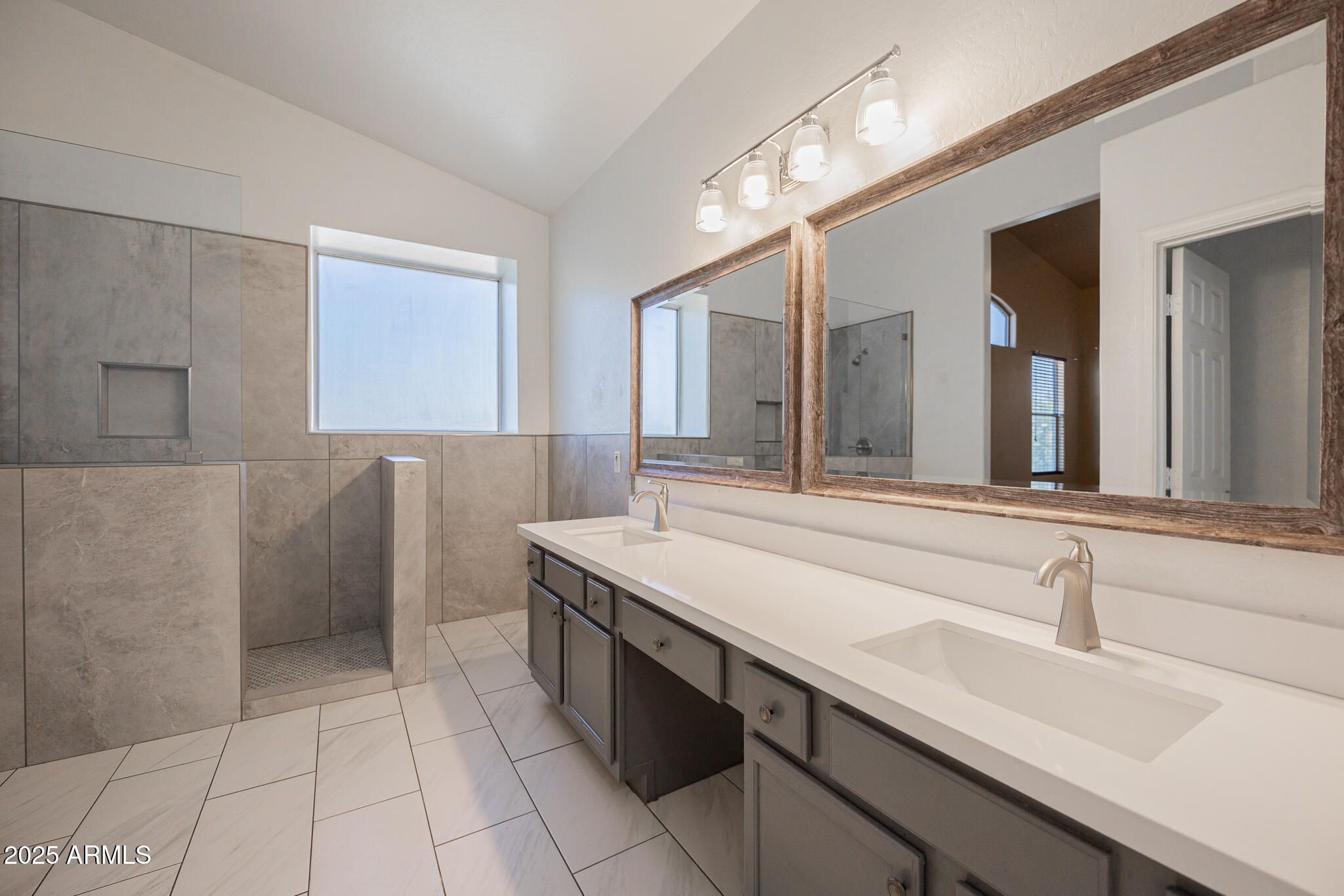730 West Kent Place Chandler, AZ 85225 - Photo 15 of 29 a bathroom with a sink a toilet a mirror and vanity