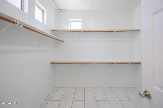 a view of an empty walk in closet