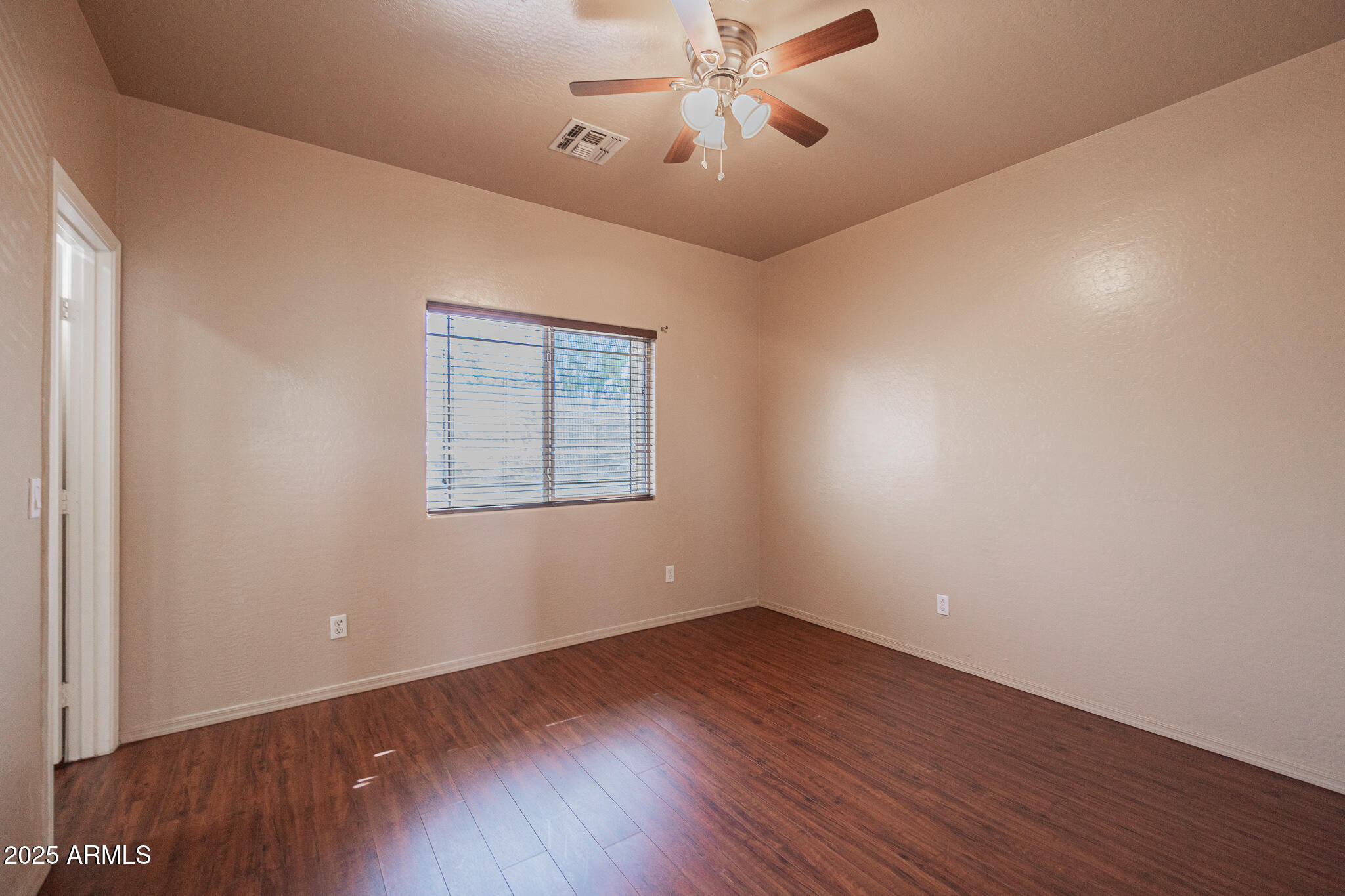 730 West Kent Place Chandler, AZ 85225 - Photo 18 of 29 a view of a room with wooden floor and windows