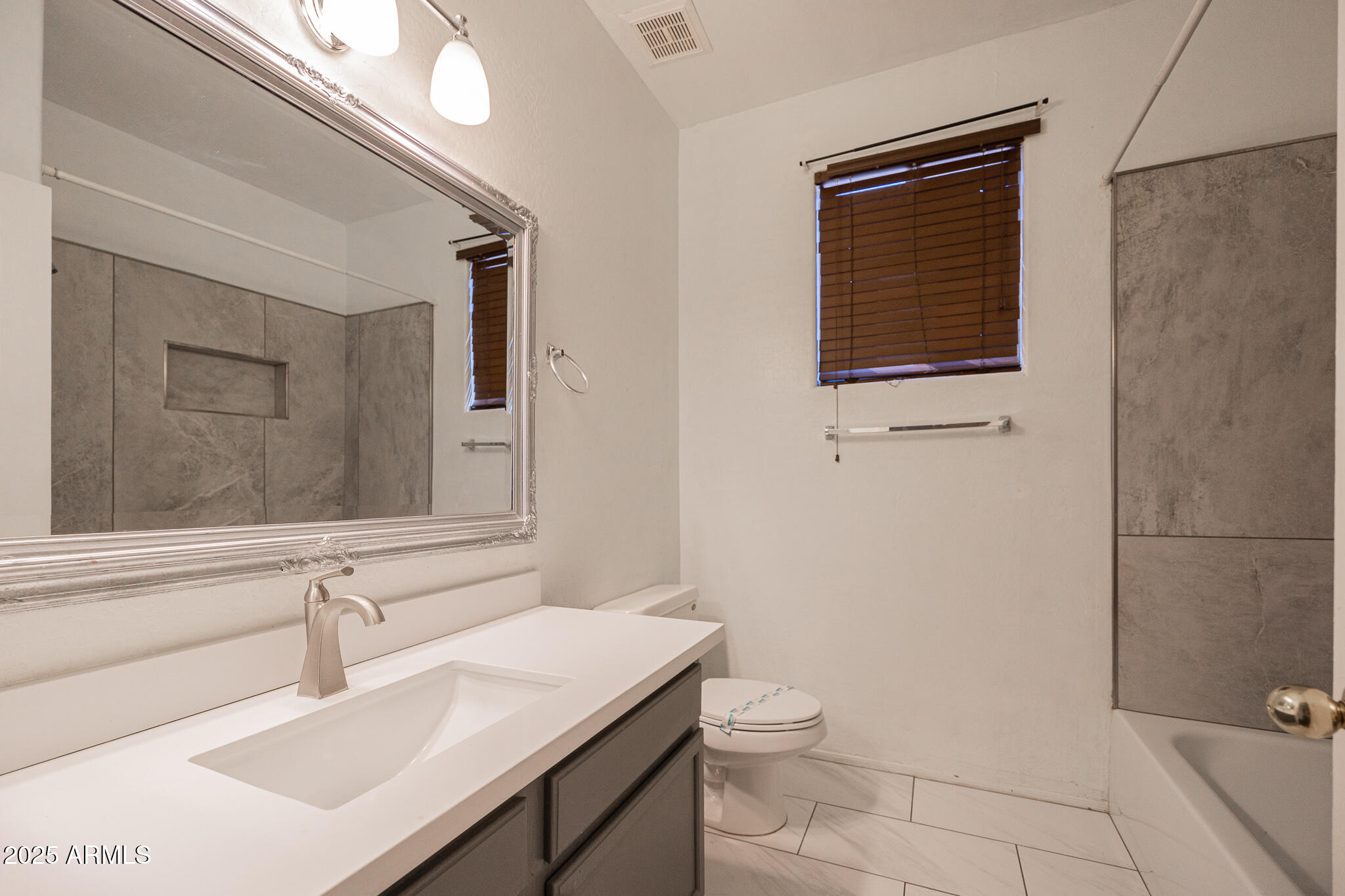 730 West Kent Place Chandler, AZ 85225 - Photo 20 of 29 a bathroom with a sink a toilet and mirror