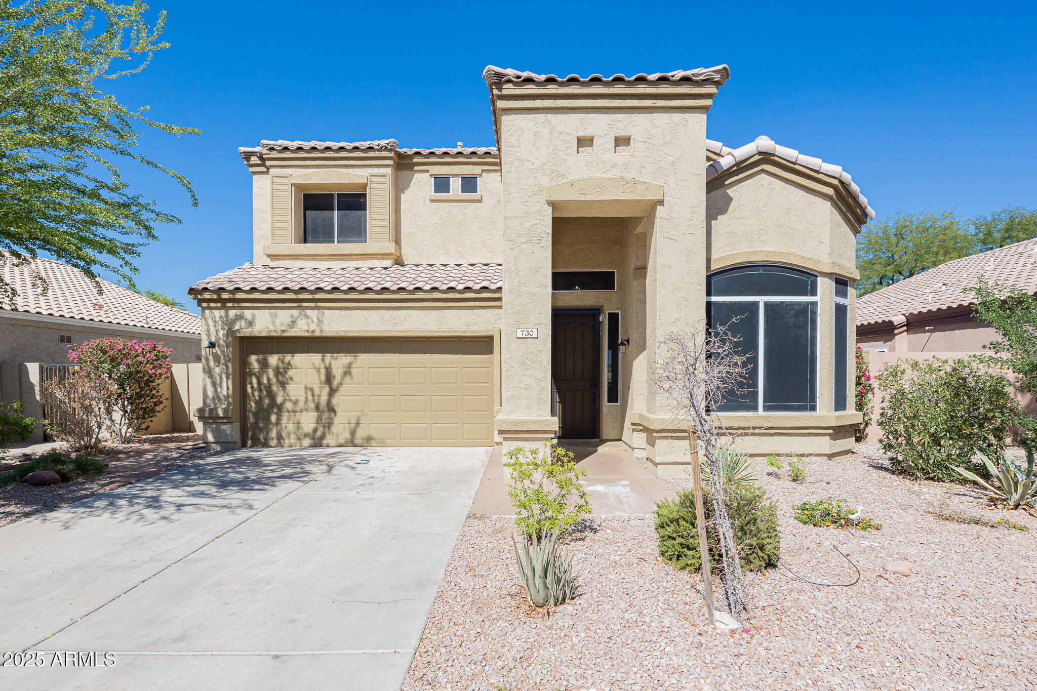730 West Kent Place Chandler, AZ 85225 - Photo 2 of 29 a front view of a house with a yard