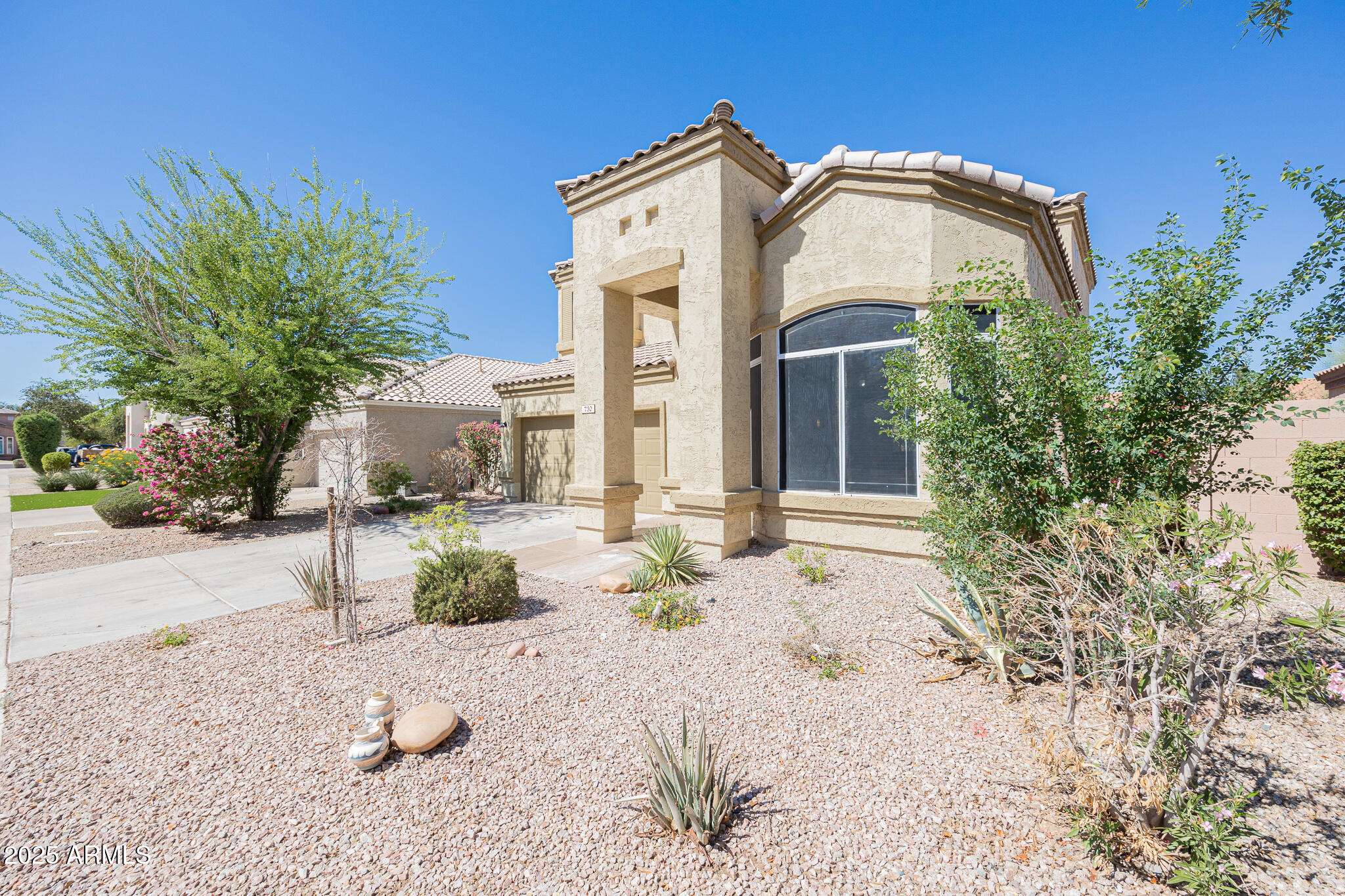730 West Kent Place Chandler, AZ 85225 - Photo 3 of 29 a front view of a house with a yard
