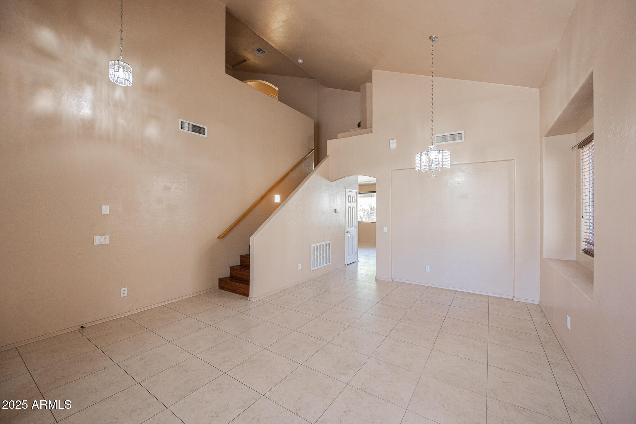 730 West Kent Place Chandler, AZ 85225 - Photo 6 of 29 an empty room with wooden floor and windows