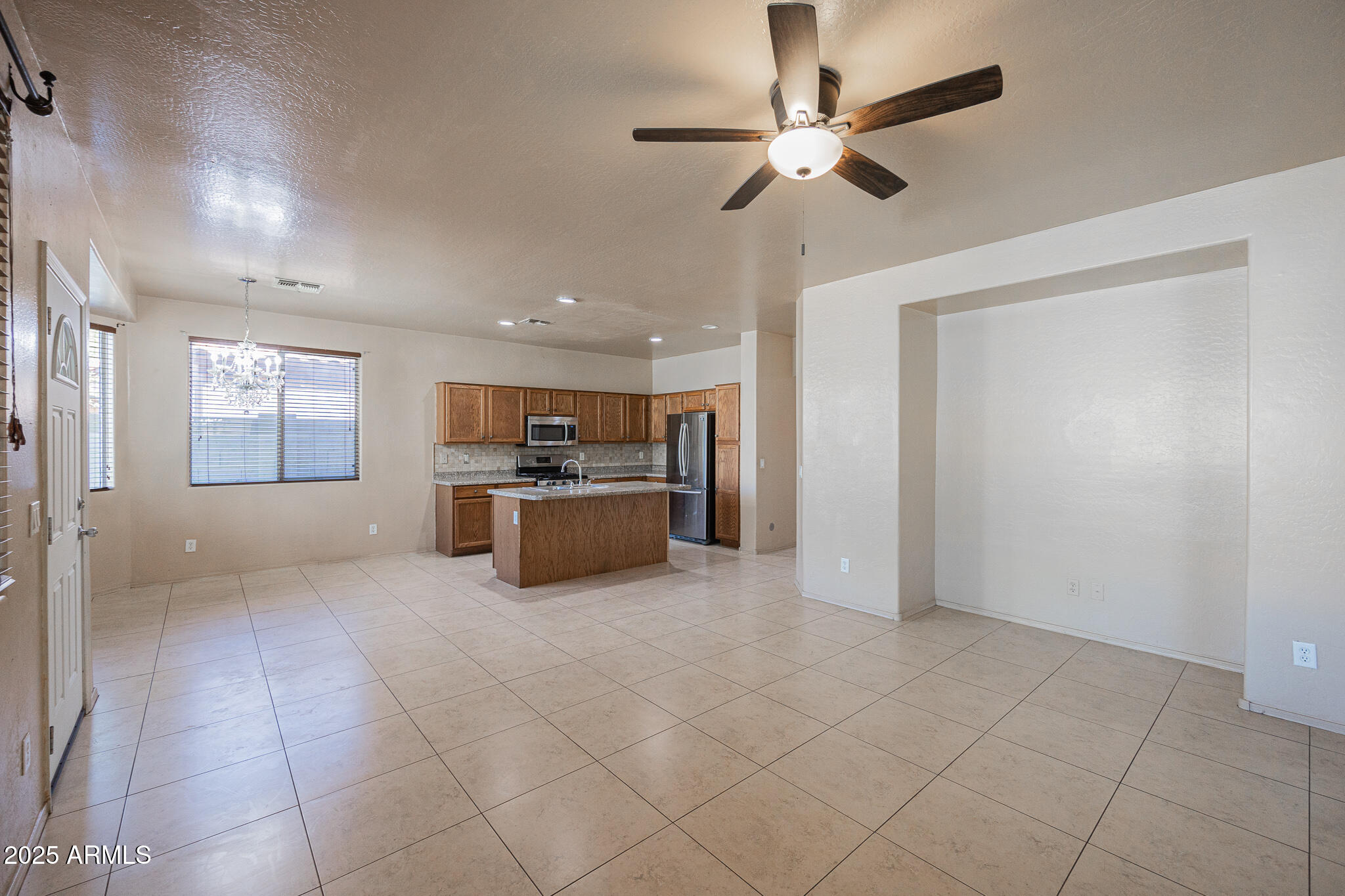 730 West Kent Place Chandler, AZ 85225 - Photo 8 of 29 a kitchen with a cabinets and a stove top oven