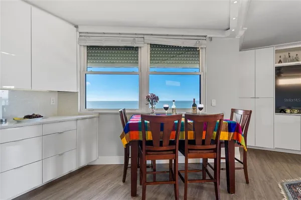 a room that has a table and chairs in it